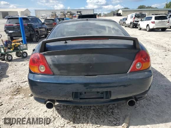 2003 Hyundai Tiburon GT с VIN KMHHN65F03U066786, выставлен на аукционе Copart как лот 84249025 с пробегом 178 084 миль миль и Чистый • Clean title. История ставок и продаж доступна на DreamBid. Изображение 6.