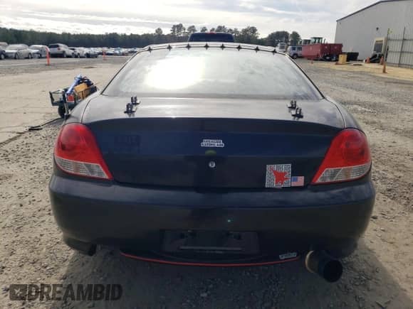 2005 Hyundai Tiburon GT с VIN KMHHN65F95U181518, выставлен на аукционе Copart как лот 41125854 с пробегом 158 863 миль миль и Списание • Salvage title. История ставок и продаж доступна на DreamBid. Изображение 6.