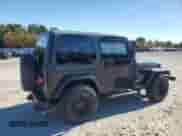 2000 Jeep Wrangler Sport with VIN 1J4FA49S1YP796600, listed as a Copart auction lot 82574545 with 128,340 mi miles and Clean title. Bid and sale history available at DreamBid. Image 3.