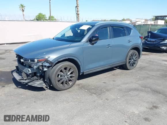 2022 Mazda CX-5 S Preferred z VIN JM3KFBCM2N1565165, wystawiony jako IAAI lot #42507203 z przebiegiem 39 853 mil mil oraz . Historia ofert i sprzedaży dostępna na DreamBid. Obrazek 2.
