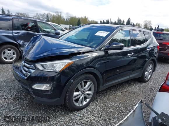 2015 Hyundai Santa Fe z VIN 5XYZWDLA2FG245029, wystawiony jako IAAI lot #42021999 z przebiegiem 135 021 mil mil oraz . Historia ofert i sprzedaży dostępna na DreamBid. Obrazek 14.