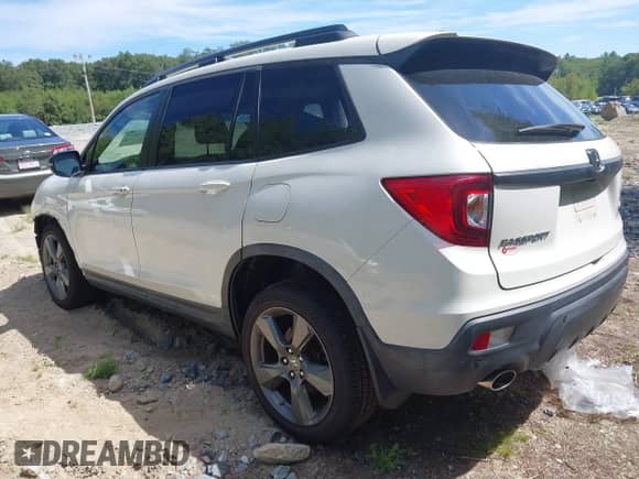 2019 Honda Passport Touring with VIN 5FNYF8H97KB004537, listed as a IAAI auction lot 42940649 with 50,490 mi miles and . Bid and sale history available at DreamBid. Image 3.
