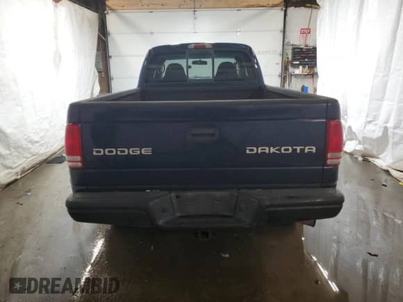 2004 Dodge Dakota Sport z VIN 1D7HG32N54S525290, wystawiony jako Copart lot #77141804 z przebiegiem 217 012 mil mil oraz Szkoda całkowita • Salvage title. Historia ofert i sprzedaży dostępna na DreamBid. Obrazek 6.