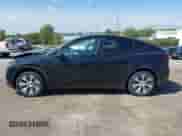 2023 Tesla Model Y Long Range z VIN 7SAYGDEE0PA201841, wystawiony jako IAAI lot #43158634 z przebiegiem 10 356 mil mil oraz . Historia ofert i sprzedaży dostępna na DreamBid. Obrazek 14.