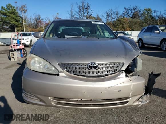 2002 Toyota Camry LE z VIN 4T1BE32K82U588621, wystawiony jako Copart lot #86985085 z przebiegiem 252 745 mil mil oraz Szkoda całkowita • Salvage title. Historia ofert i sprzedaży dostępna na DreamBid. Obrazek 5.