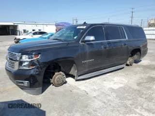 2017 Chevrolet Suburban Premier with VIN 1GNSKJKC4HR207022, listed as a Copart auction lot 60662095 with 97,164 mi miles and Salvage title. Bid and sale history available at DreamBid. Image 1.