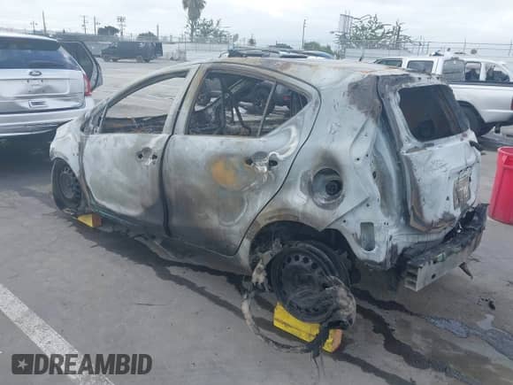 2014 Toyota Prius One with VIN JTDKDTB32E1061289, listed as a IAAI auction lot 42836175 with Not provided miles and . Bid and sale history available at DreamBid. Image 3.