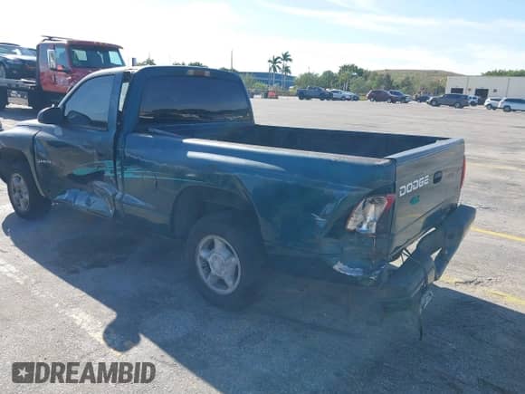 1998 Dodge Dakota SLT z VIN 1B7FL26X2WS685844, wystawiony jako IAAI lot #41857719 z przebiegiem Nie podano mil oraz . Historia ofert i sprzedaży dostępna na DreamBid. Obrazek 3.