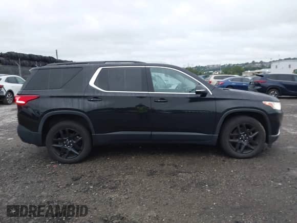2019 Chevrolet Traverse LT Cloth z VIN 1GNEVGKW3KJ149900, wystawiony jako IAAI lot #42875473 z przebiegiem 134 707 mil mil oraz . Historia ofert i sprzedaży dostępna na DreamBid. Obrazek 13.