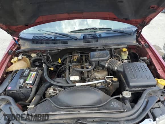 2002 Jeep Grand Cherokee Sport with VIN 1J4GW38S72C252344, listed as a Copart auction lot 61769485 with 306,152 mi miles and Salvage title. Bid and sale history available at DreamBid. Image 12.