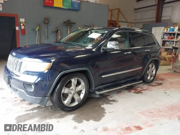 2012 Jeep Grand Cherokee Overland z VIN 1C4RJFCG1CC262788, wystawiony jako IAAI lot #43212743 z przebiegiem 211 731 mil mil oraz . Historia ofert i sprzedaży dostępna na DreamBid. Obrazek 2.