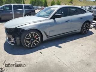 2024 BMW i4 xDrive40 with VIN WBY83FB09RFR90861, listed as a Copart auction lot 63312395 with 17,414 mi miles and Salvage title. Bid and sale history available at DreamBid. Image 1.