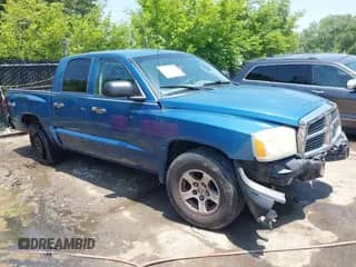 2005 Dodge Dakota SLT with VIN 1D7HW48N25S112499, listed as a IAAI auction lot 42434700 with 216,817 mi miles and . Bid and sale history available at DreamBid. Image 1.
