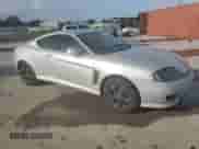 2006 Hyundai Tiburon GS с VIN KMHHM65D76U222358, выставлен на аукционе Copart как лот 64834055 с пробегом 129 477 миль миль и Списание • Salvage title. История ставок и продаж доступна на DreamBid. Изображение 4.
