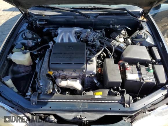 1995 Toyota Camry LE z VIN JT2GK12E3S0117364, wystawiony jako Copart lot #65818255 z przebiegiem 215 464 mil mil oraz Szkoda całkowita • Salvage title. Historia ofert i sprzedaży dostępna na DreamBid. Obrazek 11.