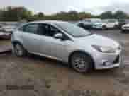 2014 Ford Focus Titanium with VIN 1FADP3J26EL243452, listed as a Copart auction lot 82123775 with 127,009 mi miles and Salvage title. Bid and sale history available at DreamBid. Image 4.