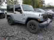 2012 Jeep Wrangler Sport z VIN 1C4AJWAG6CL228765, wystawiony jako Copart lot #80979855 z przebiegiem 216 434 mil mil oraz Szkoda całkowita • Salvage title. Historia ofert i sprzedaży dostępna na DreamBid. Obrazek 4.