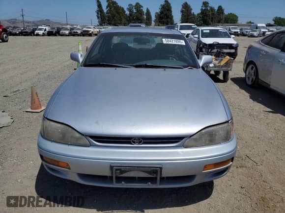 1995 Toyota Camry z VIN 4T1GK12C7SU099655, wystawiony jako Copart lot #58421895 z przebiegiem 89 299 mil mil oraz Czysty tytuł • Clean title. Historia ofert i sprzedaży dostępna na DreamBid. Obrazek 5.