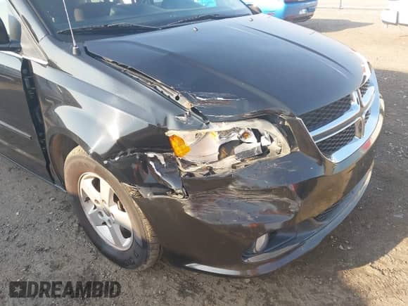 2012 Dodge Grand Caravan Crew z VIN 2C4RDGDG0CR165214, wystawiony jako IAAI lot #43256532 z przebiegiem 96 380 mil mil oraz . Historia ofert i sprzedaży dostępna na DreamBid. Obrazek 6.