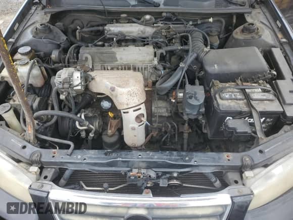 2001 Toyota Camry CE z VIN 4T1BG22K71U029970, wystawiony jako Copart lot #67166085 z przebiegiem 264 579 mil mil oraz Czysty tytuł • Clean title. Historia ofert i sprzedaży dostępna na DreamBid. Obrazek 11.