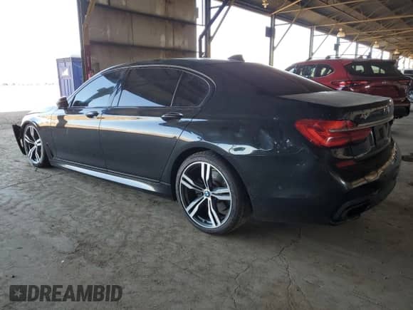 2016 BMW 7 Series 750i с VIN WBA7F0C56GGL99824, выставлен на аукционе Copart как лот 62845125 с пробегом 114 694 миль миль и Списание • Salvage title. История ставок и продаж доступна на DreamBid. Изображение 2.