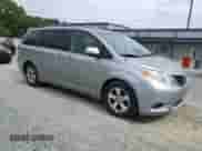 2014 Toyota Sienna LE AAS with VIN 5TDKK3DC7ES444005, listed as a Copart auction lot 86101715 with 115,208 mi miles and Salvage title. Bid and sale history available at DreamBid. Image 4.