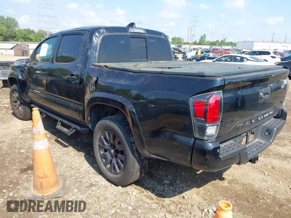 2021 Toyota Tacoma Limited with VIN 3TMGZ5AN8MM390280, listed as a IAAI auction lot 42869454 with 61,704 mi miles and . Bid and sale history available at DreamBid. Image 3.