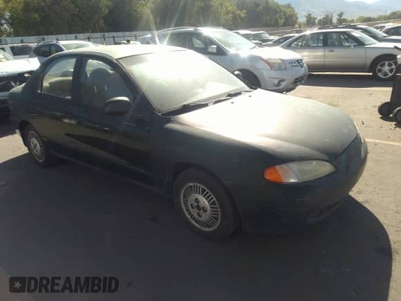 1997 Hyundai Elantra z VIN KMHJF24MXVU546196, wystawiony jako IAAI lot #34978340 z przebiegiem 229 863 mil mil oraz . Historia ofert i sprzedaży dostępna na DreamBid. Obrazek 1.