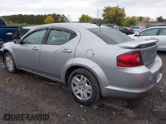 2013 Dodge Avenger SE with VIN 1C3CDZAB5DN771735, listed as a IAAI auction lot 43395877 with 87,931 mi miles and . Bid and sale history available at DreamBid. Image 3.