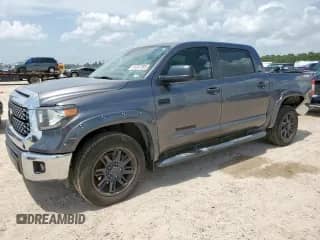 2021 Toyota Tundra SR5 with VIN 5TFEY5F17MX277320, listed as a Copart auction lot 61057285 with 128,865 mi miles and Salvage title. Bid and sale history available at DreamBid. Image 1.