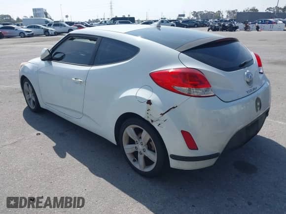 2014 Hyundai Veloster with VIN KMHTC6AD8EU209409, listed as a IAAI auction lot 42087236 with 124,459 mi miles and . Bid and sale history available at DreamBid. Image 3.