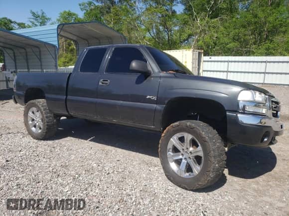 2003 GMC Sierra 1500 SLE with VIN 2GTEK19T331259948, listed as a Copart auction lot 52145845 with 214,374 mi miles and Salvage title. Bid and sale history available at DreamBid. Image 4.