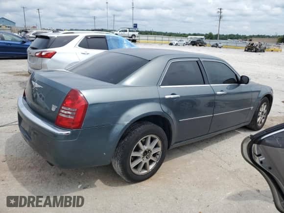 2005 Chrysler 300 300C AWD with VIN 2C3AK63H15H611519, listed as a Copart auction lot 63765655 with 168,036 mi miles and Salvage title. Bid and sale history available at DreamBid. Image 3.