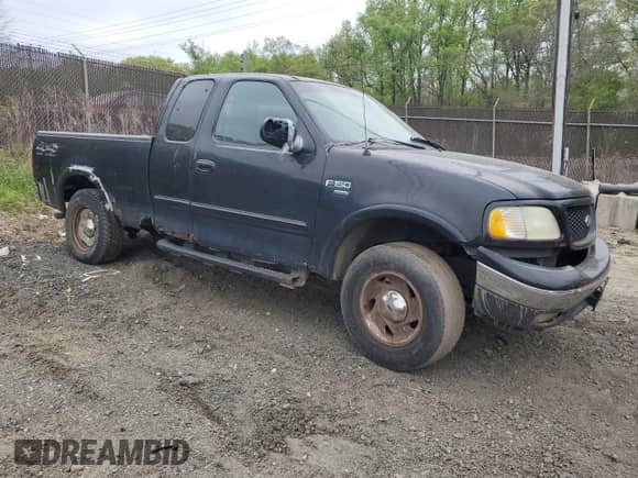 2000 Ford F-150 XL with VIN 1FTRX18W0YNC08668, listed as a Copart auction lot 53636035 with Not provided miles and Salvage title. Bid and sale history available at DreamBid. Image 4.