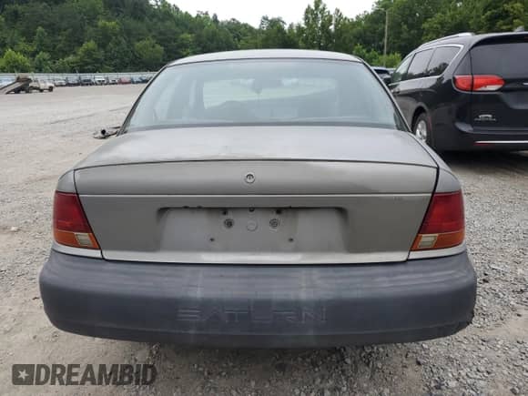 1999 Saturn SL с VIN 1G8ZH5284XZ272177, выставлен на аукционе Copart как лот 66902665 с пробегом 117 054 миль миль и Списание • Salvage title. История ставок и продаж доступна на DreamBid. Изображение 6.