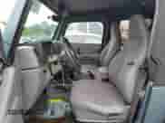 1998 Jeep Wrangler Sport z VIN 1J4FY19S0WP701077, wystawiony jako Copart lot #71093475 z przebiegiem 120 277 mil mil oraz Czysty tytuł • Clean title. Historia ofert i sprzedaży dostępna na DreamBid. Obrazek 7.