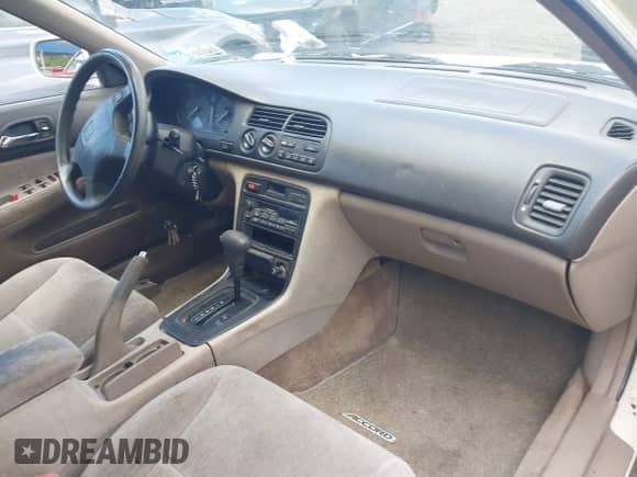 1994 Honda Accord with VIN 1HGCD564XRA014313, listed as a IAAI auction lot 42796801 with 76,616 mi miles and . Bid and sale history available at DreamBid. Image 5.