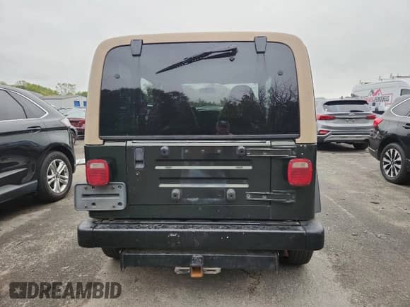 1997 Jeep Wrangler SE with VIN 1J4FY29P3VP474693, listed as a Copart auction lot 80686825 with 206,408 mi miles and Salvage title. Bid and sale history available at DreamBid. Image 6.