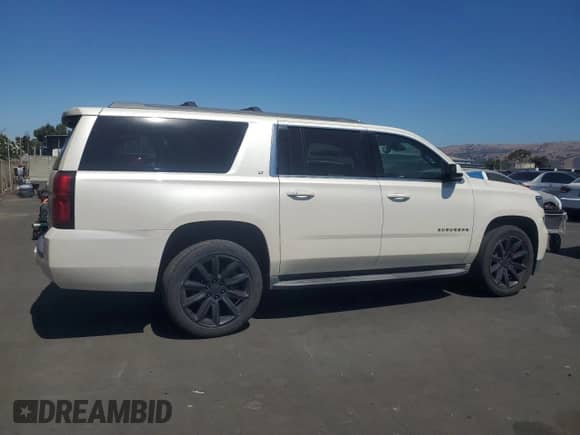 2015 Chevrolet Suburban LT with VIN 1GNSKJKC4FR739657, listed as a Copart auction lot 70586615 with 116,344 mi miles and Salvage title. Bid and sale history available at DreamBid. Image 3.