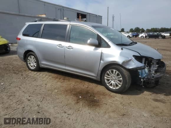 2014 Toyota Sienna XLE with VIN 5TDYK3DCXES426267, listed as a Copart auction lot 81193765 with 142,543 mi miles and Salvage title. Bid and sale history available at DreamBid. Image 4.