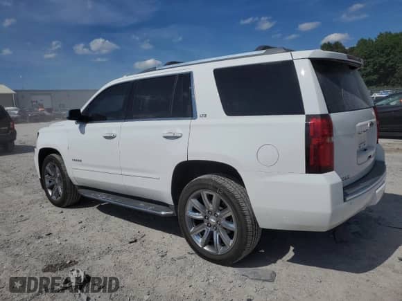 2016 Chevrolet Tahoe LTZ with VIN 1GNSCCKC4GR473440, listed as a Copart auction lot 70414425 with 158,224 mi miles and Salvage title. Bid and sale history available at DreamBid. Image 2.