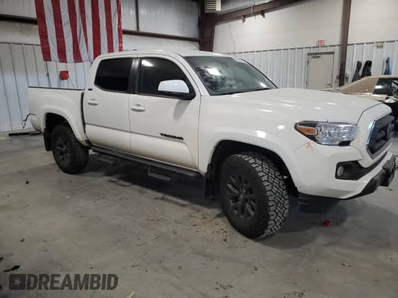 2023 Toyota Tacoma SR5 with VIN 3TYAZ5CN2PT042244, listed as a Copart auction lot 76022534 with 9,551 mi miles and Salvage title. Bid and sale history available at DreamBid. Image 4.