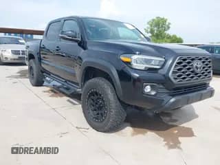 2021 Toyota Tacoma SR with VIN 3TMCZ5AN0MM408186, listed as a IAAI auction lot 42964458 with 56,895 mi miles and . Bid and sale history available at DreamBid. Image 1.