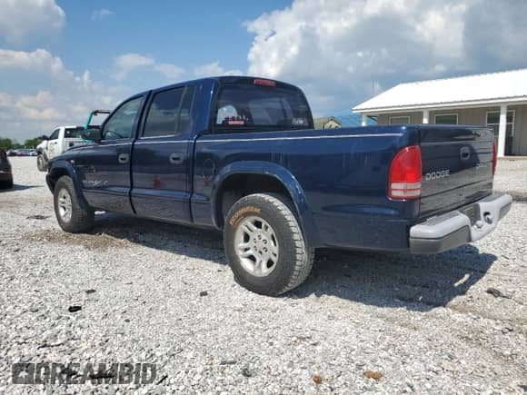 2003 Dodge Dakota Sport with VIN 1D7HL38X73S350060, listed as a Copart auction lot 56656905 with 189,248 mi miles and Salvage title. Bid and sale history available at DreamBid. Image 2.