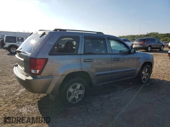 2007 Jeep Grand Cherokee Laredo with VIN 1J8GR48KX7C593322, listed as a Copart auction lot 71458485 with 166,252 mi miles and Salvage title. Bid and sale history available at DreamBid. Image 3.
