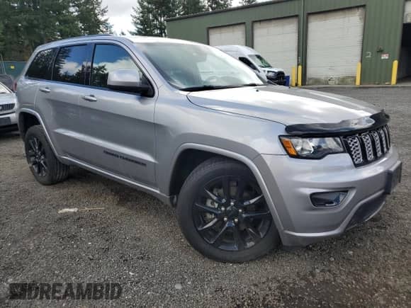 2017 Jeep Grand Cherokee Altitude with VIN 1C4RJFAG7HC720165, listed as a Copart auction lot 85197095 with 83,075 mi miles and Salvage title. Bid and sale history available at DreamBid. Image 4.