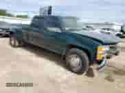 1997 Chevrolet Silverado 3500 с VIN 1GCHC33J1VF013991, выставлен на аукционе Copart как лот 56521345 с пробегом 151 189 миль миль и Списание • Salvage title. История ставок и продаж доступна на DreamBid. Изображение 4.