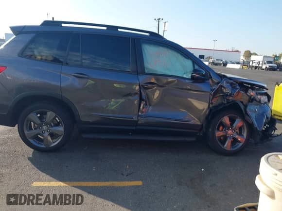 2019 Honda Passport Touring with VIN 5FNYF7H90KB006205, listed as a IAAI auction lot 43291429 with Not provided miles and . Bid and sale history available at DreamBid. Image 13.