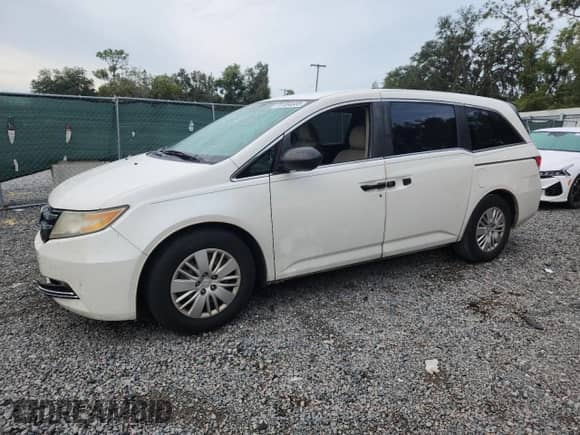 2015 Honda Odyssey LX with VIN 5FNRL5H20FB008529, listed as a Copart auction lot 81084685 with 128,269 mi miles and Salvage title. Bid and sale history available at DreamBid. Image 1.