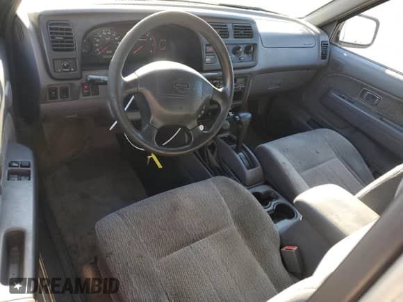 2000 Nissan Frontier XE z VIN 1N6ED26Y7YC355824, wystawiony jako Copart lot #82165565 z przebiegiem 189 111 mil mil oraz Czysty tytuł • Clean title. Historia ofert i sprzedaży dostępna na DreamBid. Obrazek 8.